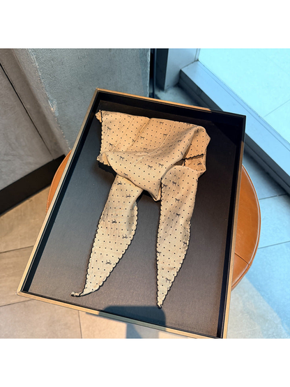 Beige polka-dot triangle scarf with small bow motifs and scalloped edging