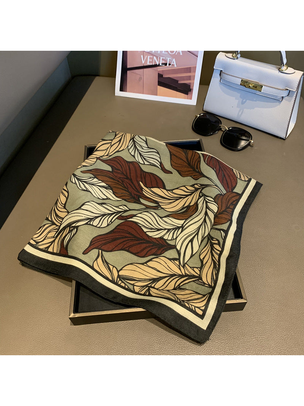 Folded Army Green leaf-print scarf with a dark striped border