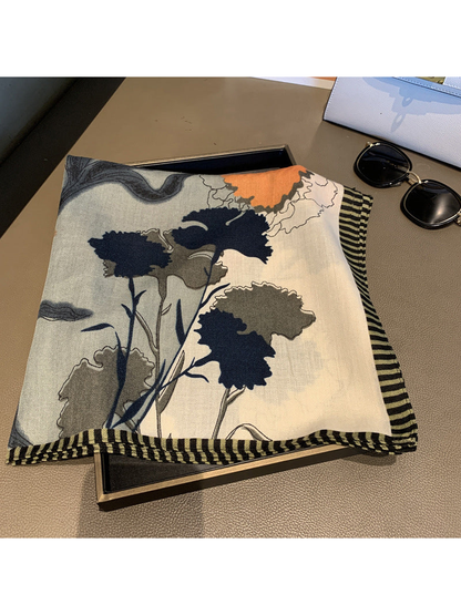 Close-up of navy and gray floral print with striped border