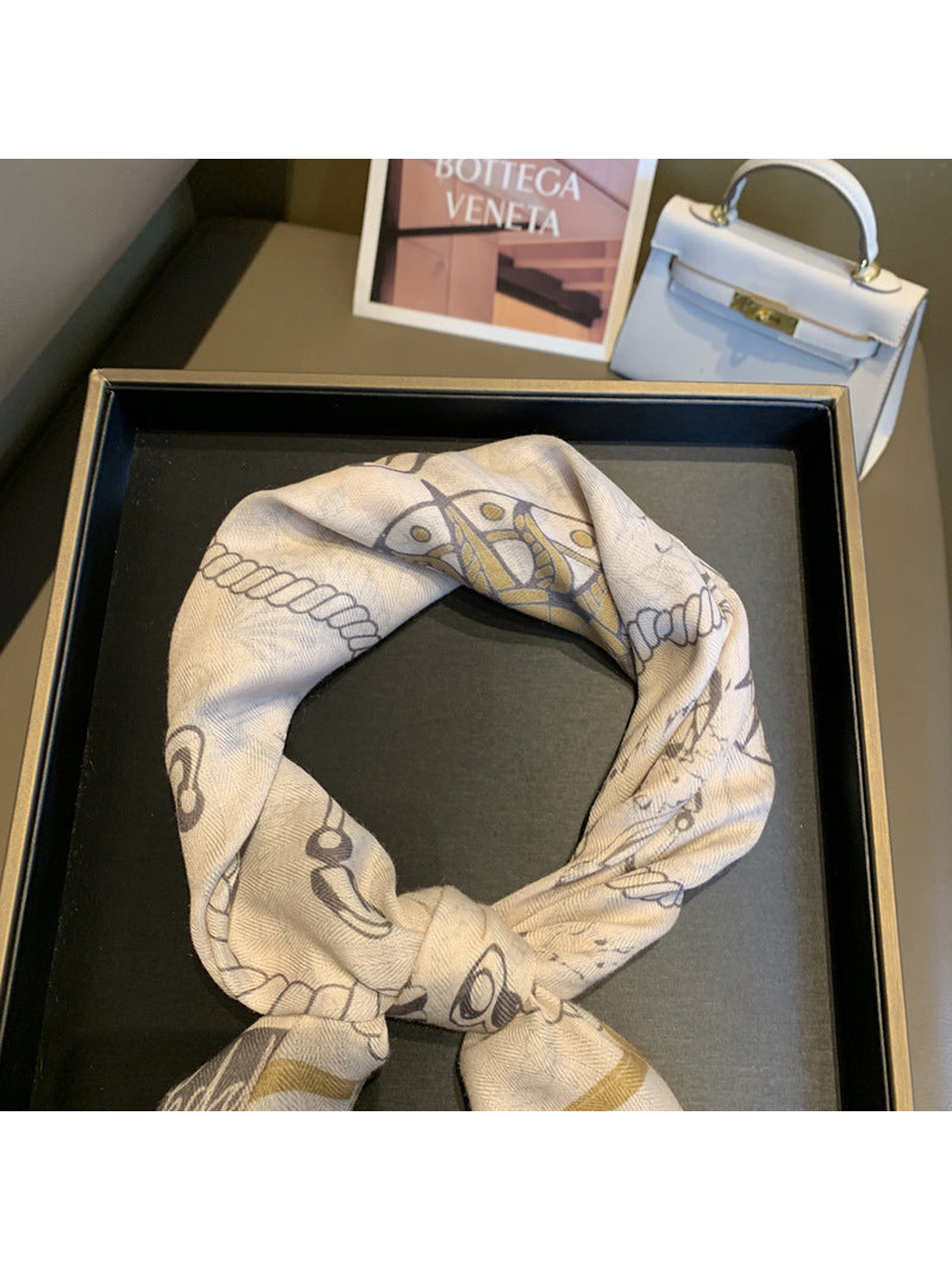 Close-up of the scarf's nautical print and fine woven-look texture