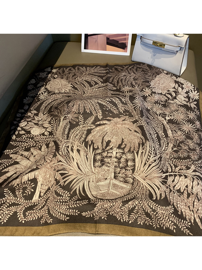 Brown square scarf spread out with an intricate botanical print and contrasting border