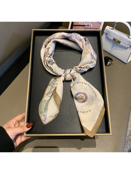 Ivory square scarf with multicolor botanical print, styled in a tied loop