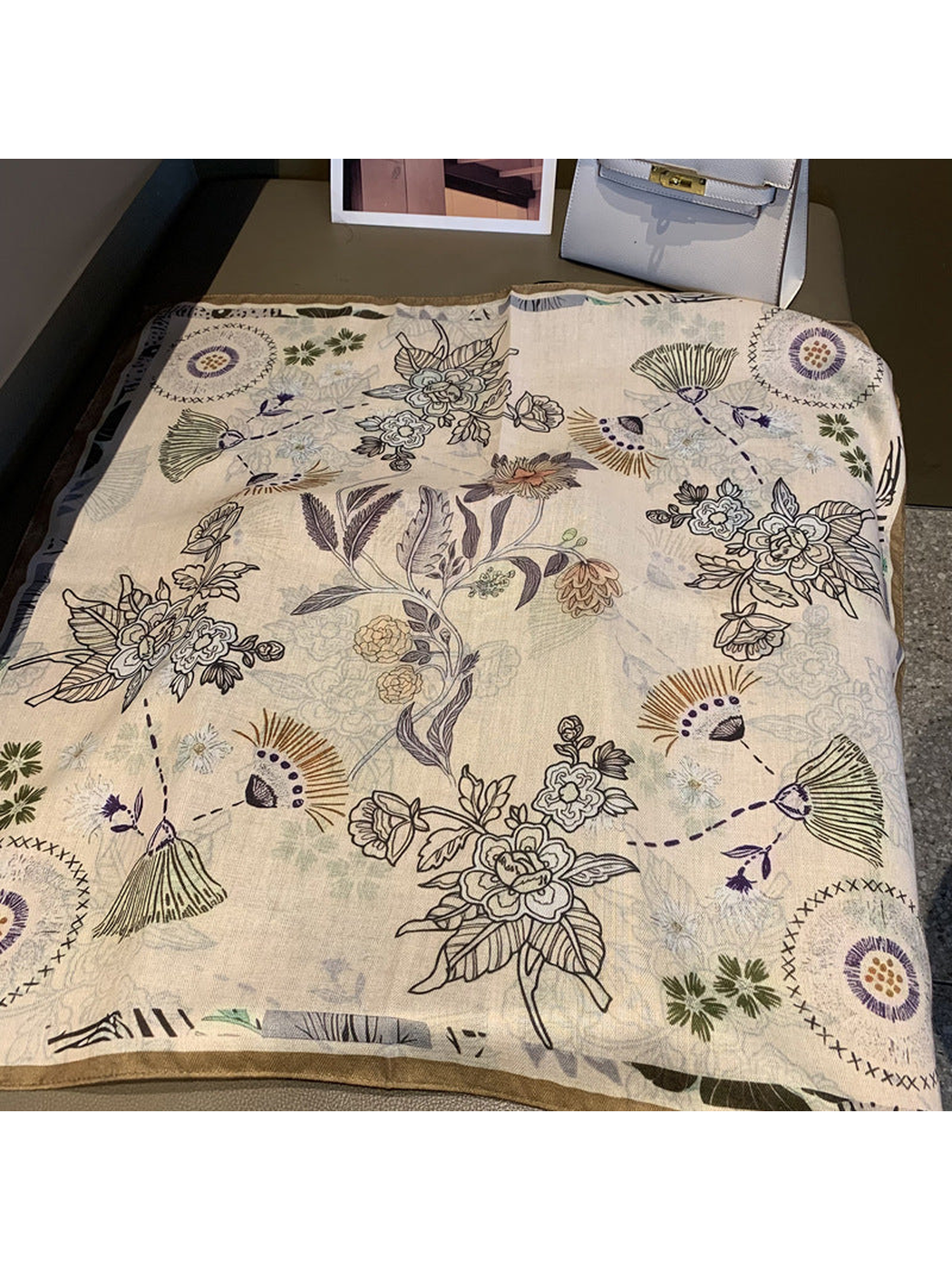 Ivory square scarf opened to show the full multicolor floral and abstract botanical pattern