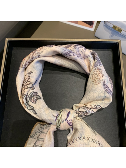 Close-up of the tied scarf and its fine woven-look surface texture