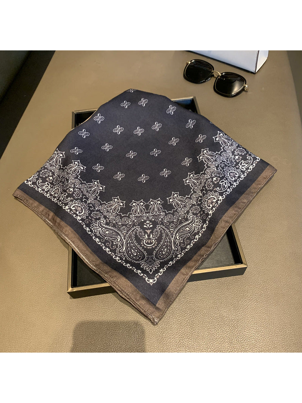 Close-up of the charcoal section, paisley border and stitched edge