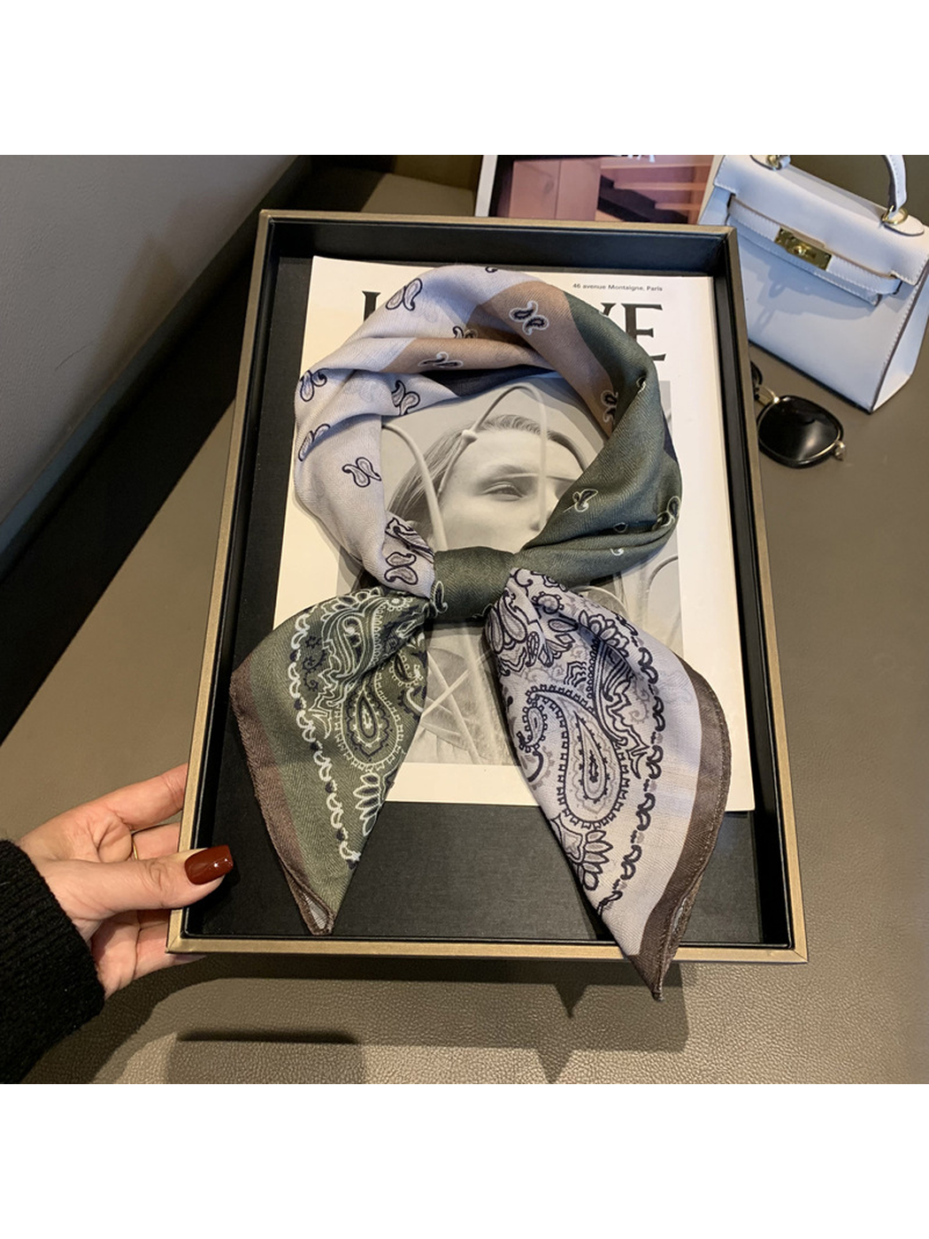 Multicolor paisley scarf tied in a loop-and-knot display