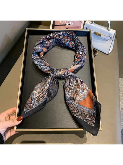 Multicolor patchwork-print square scarf styled in a looped knot