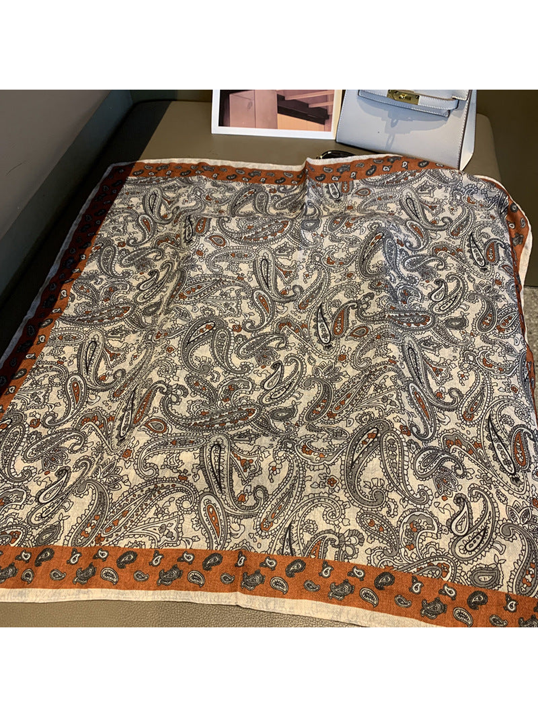 Cream paisley square scarf with rust-orange border, fully spread