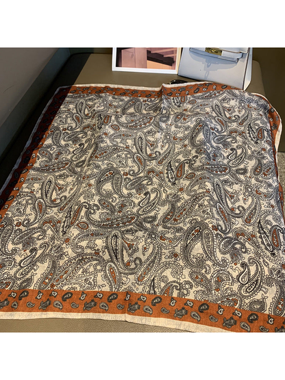 Cream paisley square scarf with rust-orange border, fully spread