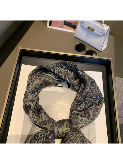 Close-up of the paisley scarf's tied loop and center knot