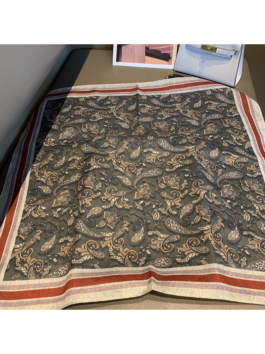 Dark gray paisley square scarf with cream and rust-red striped border