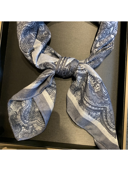 Close-up of the tied scarf ends and contrasting paisley borders