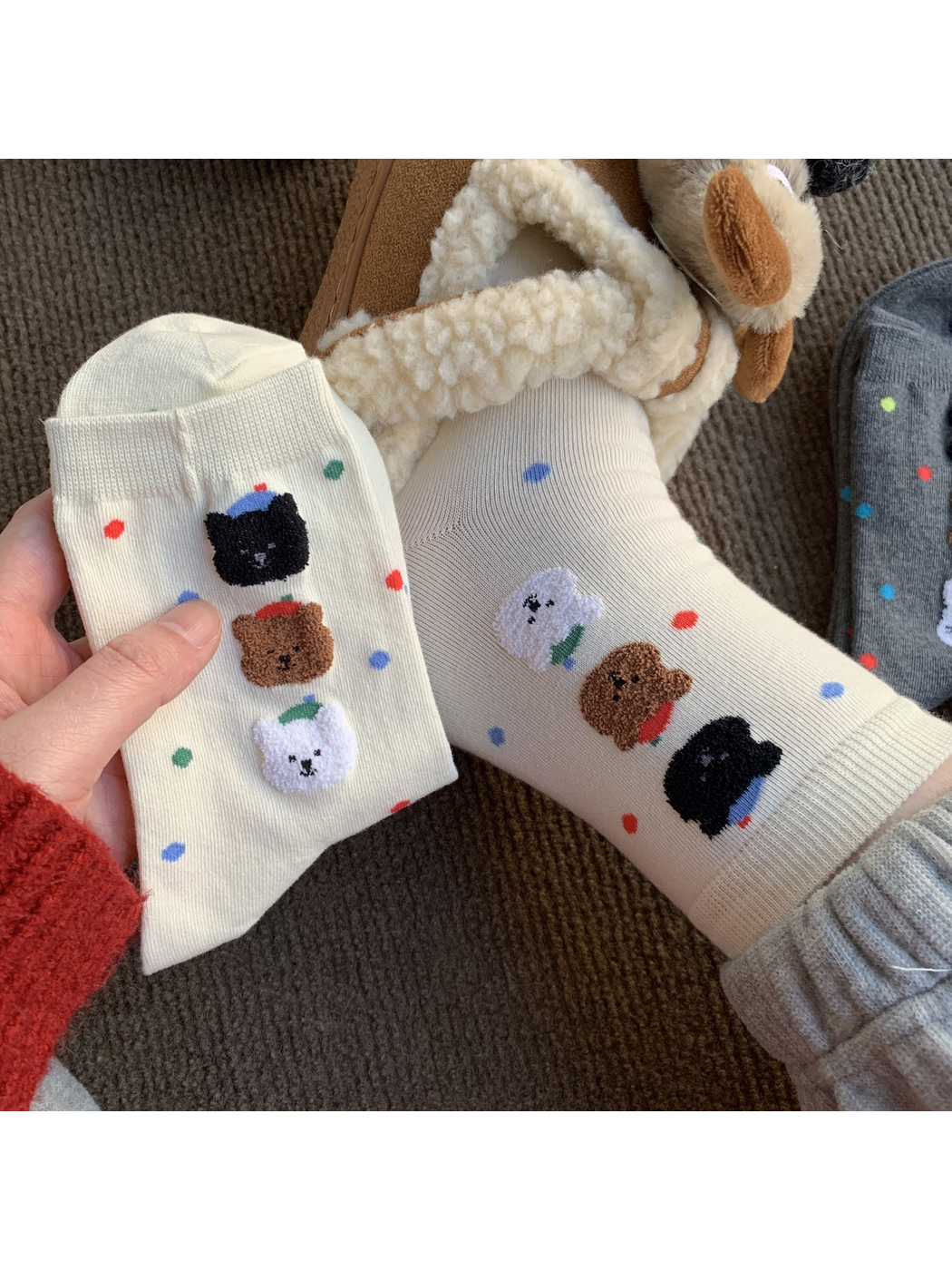 White crew socks with colorful dots and raised animal faces