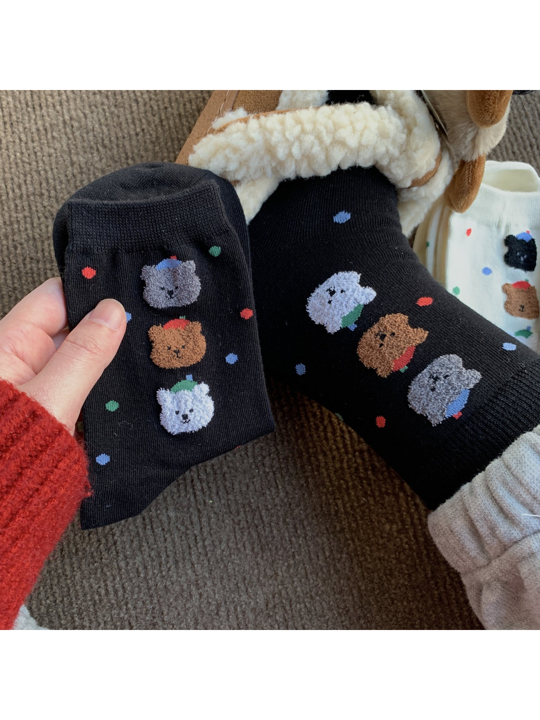 Black crew socks with colorful dots and raised animal faces