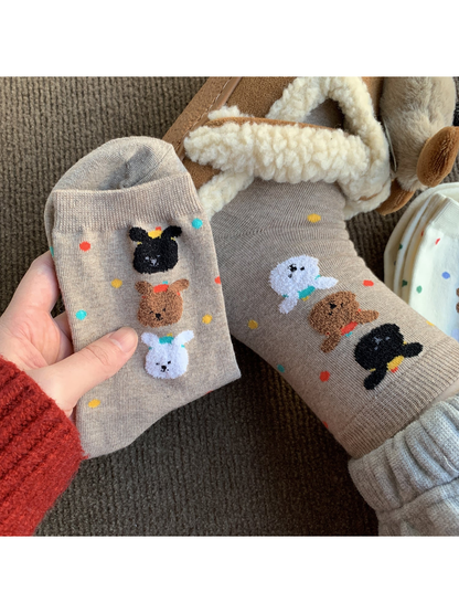 Oatmeal crew socks with colorful dots and raised animal faces