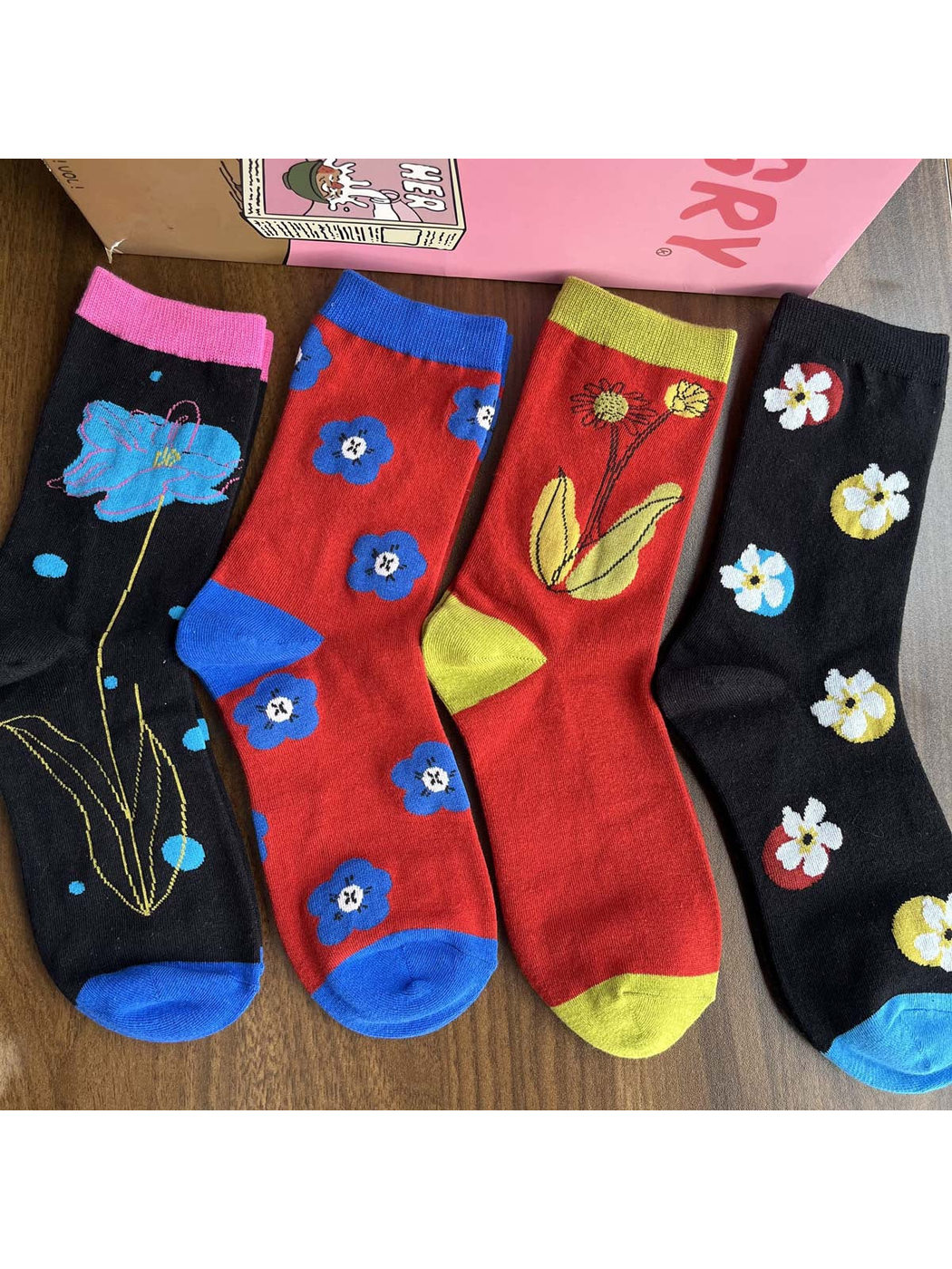 Four floral crew sock styles displayed together