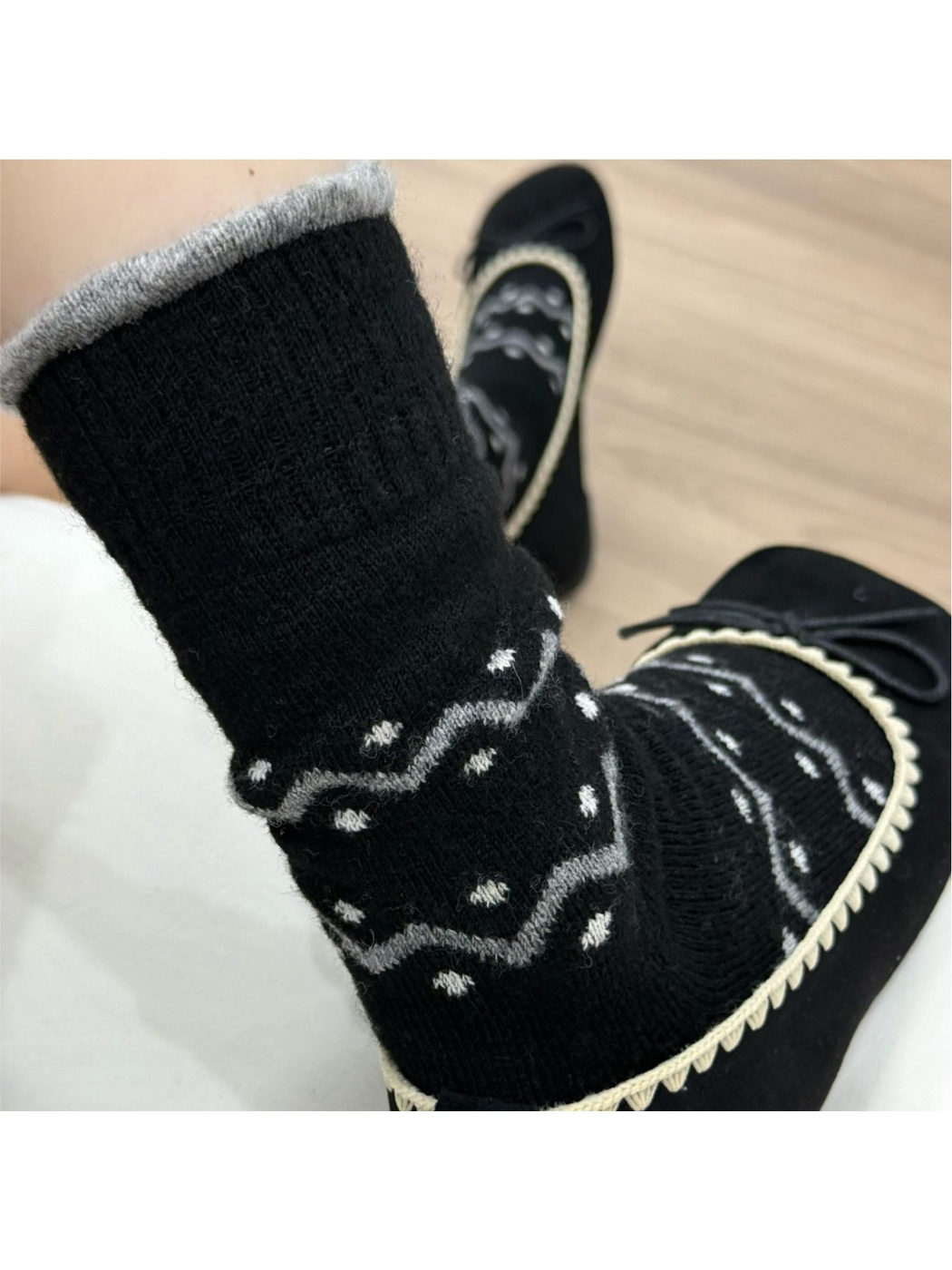 Black crew sock with gray zigzag bands and white dot accents