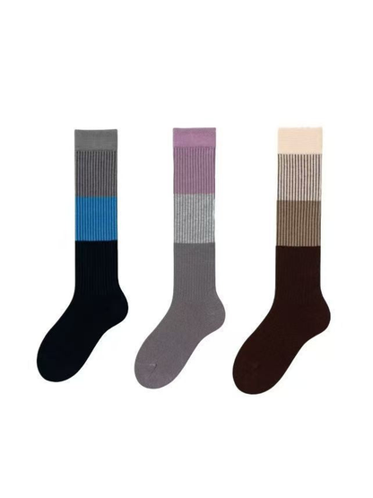 Three knee-high striped sock styles displayed together