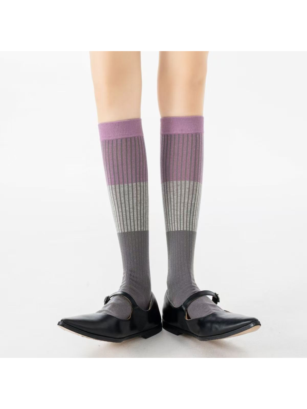 Gray Purple knee-high striped socks worn with black shoes