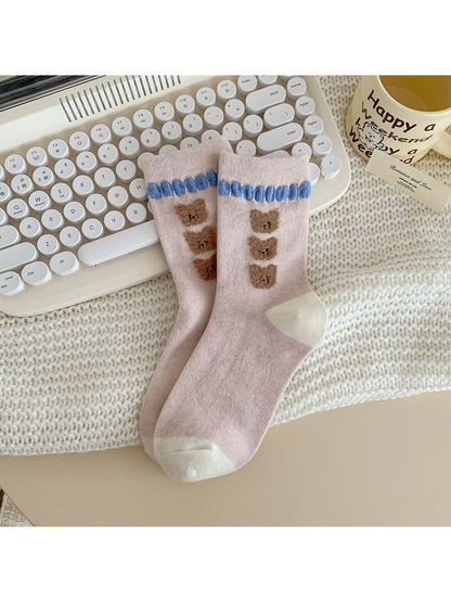 Three Bears light pink crew socks with stacked bear faces and blue trim