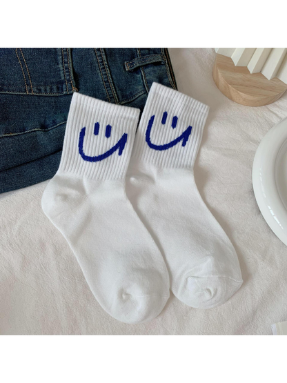 White smiley crew socks with ribbed cuffs