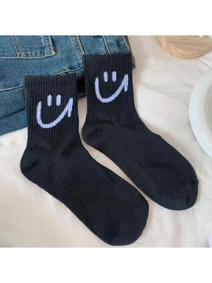 Black smiley crew socks with ribbed cuffs
