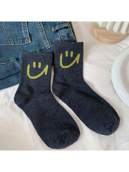 Dark gray smiley crew socks with ribbed cuffs