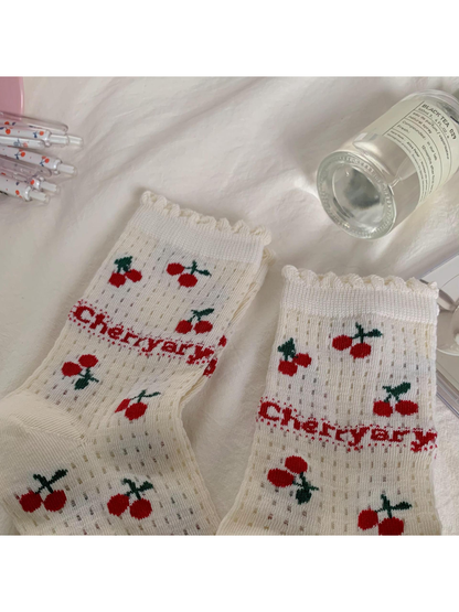 Ivory cherry-pattern socks with ruffled cuff edges