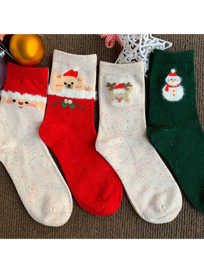 Bear, Reindeer, Santa and Snowman crew socks displayed with holiday ornaments