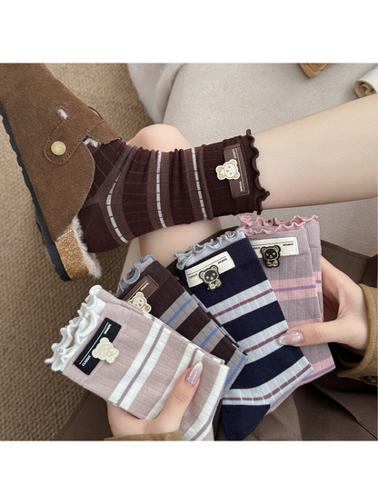 Coffee, Gray Blue, Khaki, Dusty Pink and Navy striped crew socks displayed together