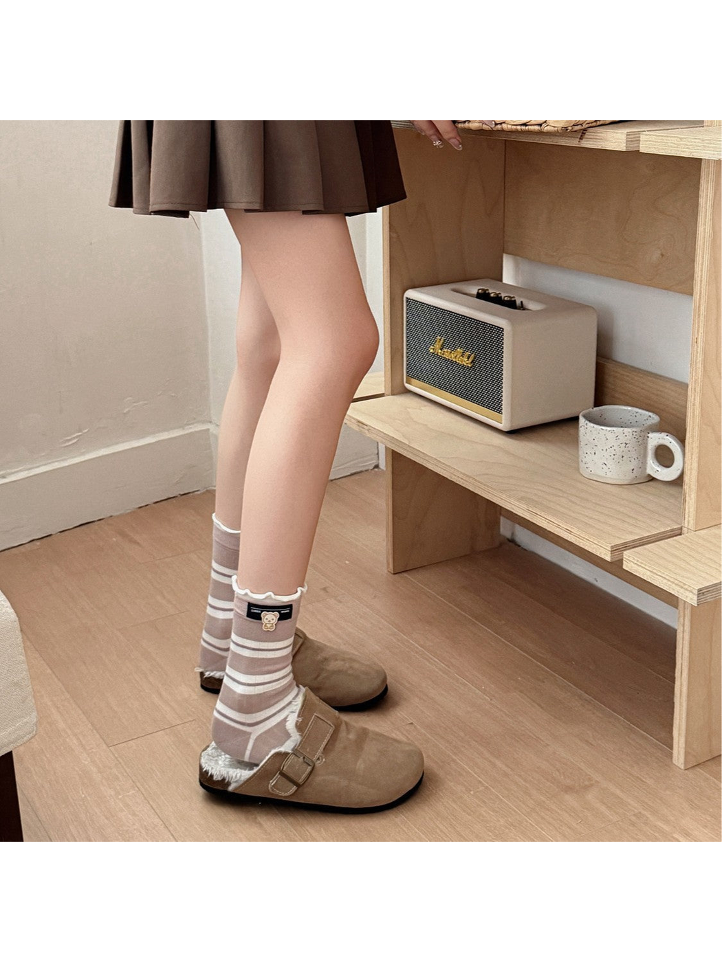 Khaki striped crew socks styled with brown clogs