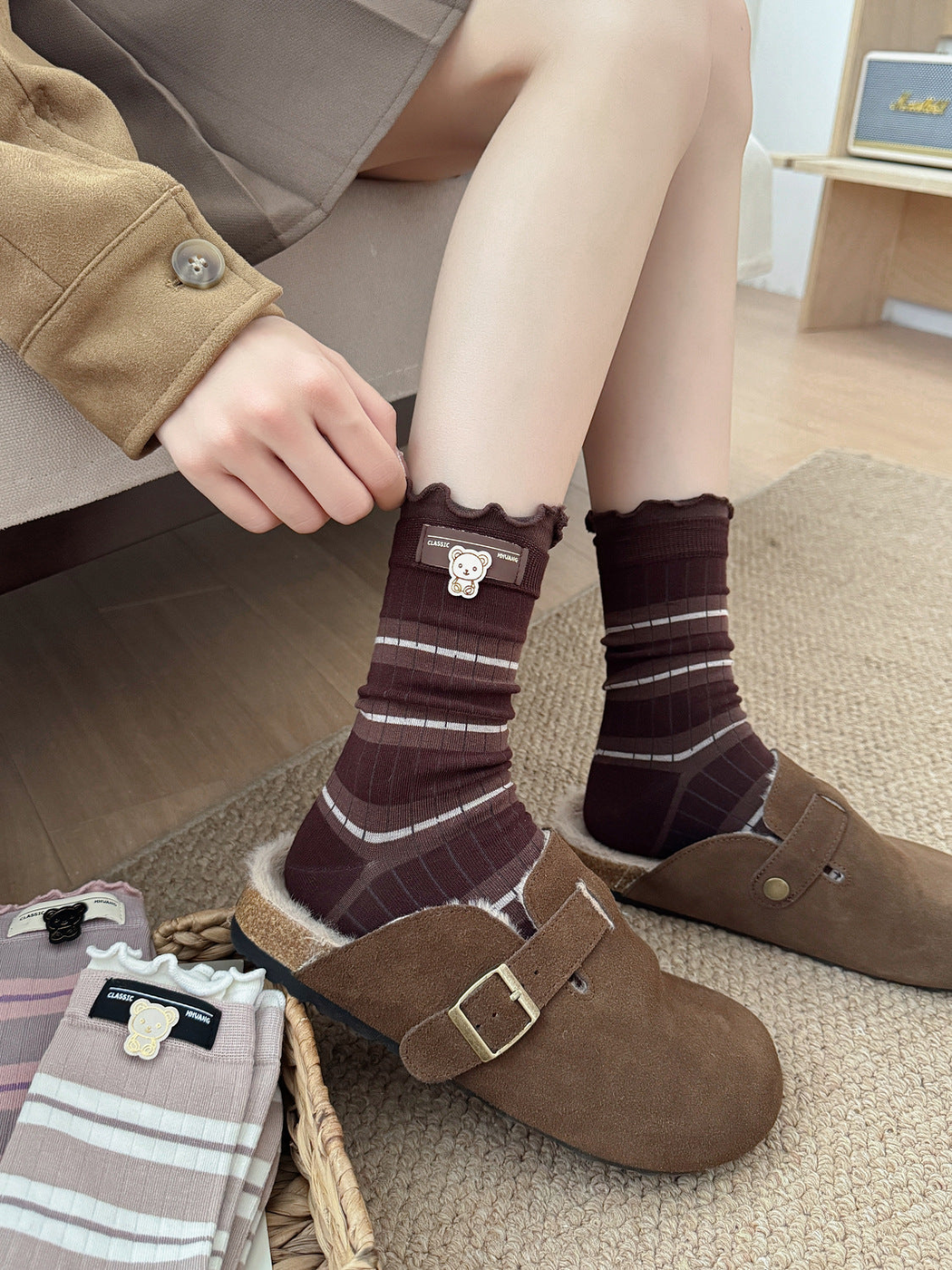 Coffee striped crew socks worn with brown clogs beside additional color options