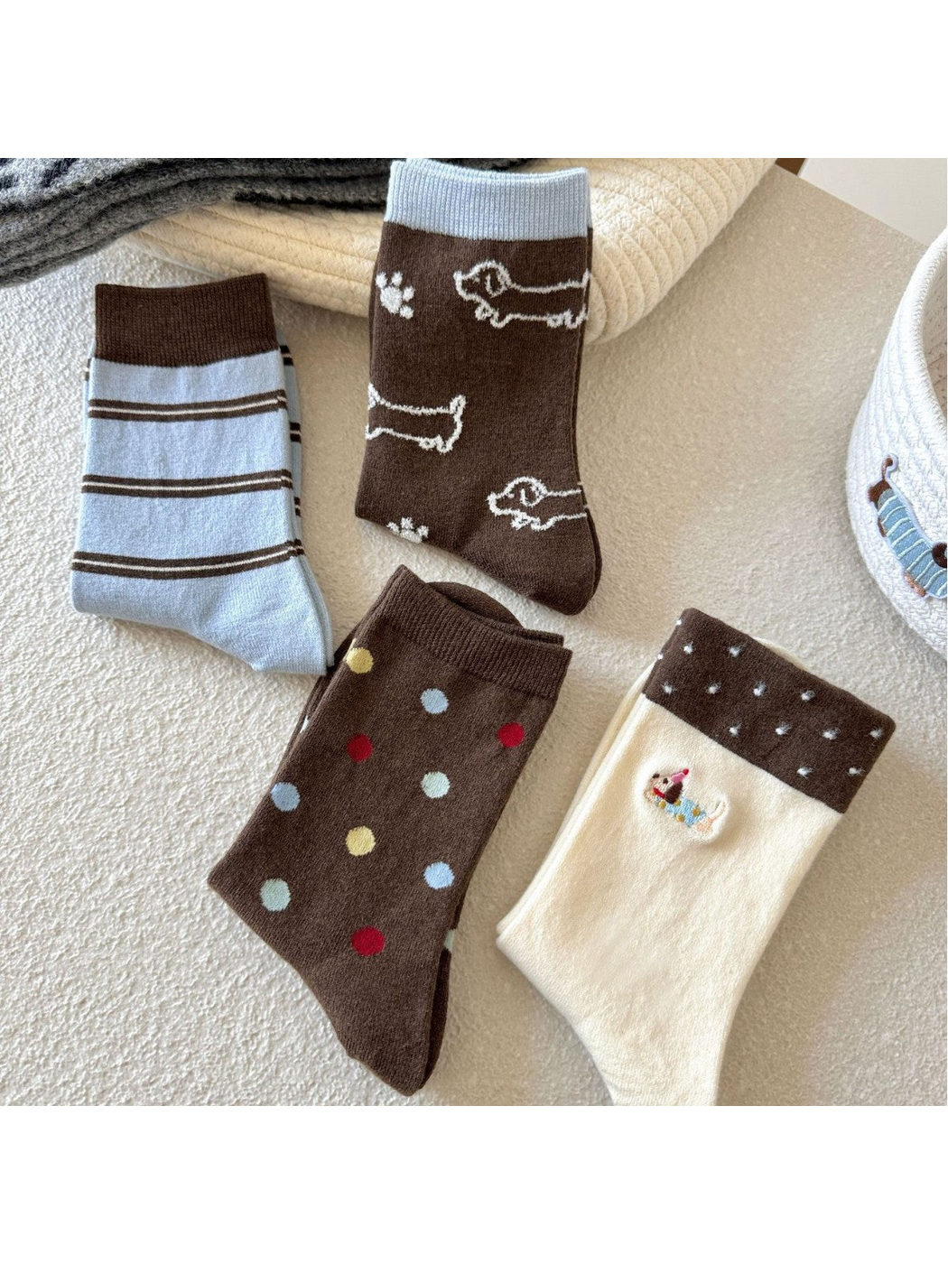 Four crew sock styles with stripes, dog outlines, polka dots and Dachshund embroidery