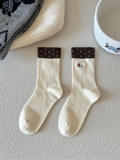 Ivory Dachshund crew socks with contrasting brown dotted cuffs