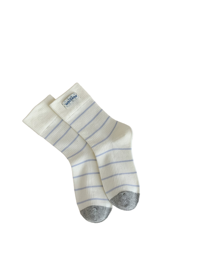 Label ivory crew socks with light blue stripes and a cuff patch