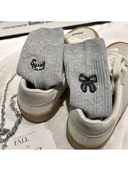 Light Gray ribbed socks with black bow and script embroidery