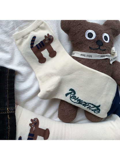 Tiger crew sock with navy toe and striped animal motif