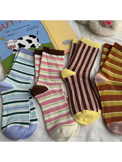 Four striped crew sock styles arranged together