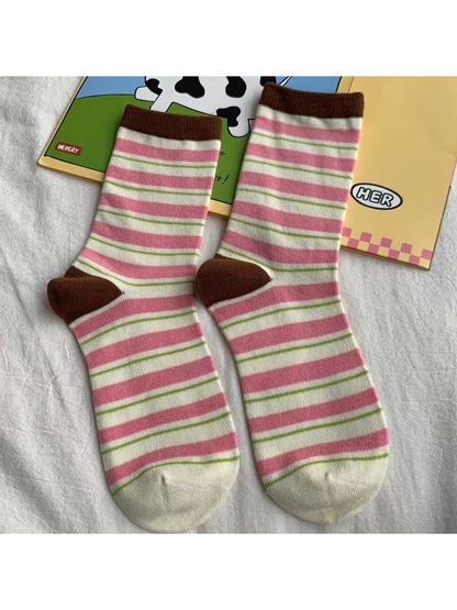 Pink striped crew socks with brown cuffs and heels