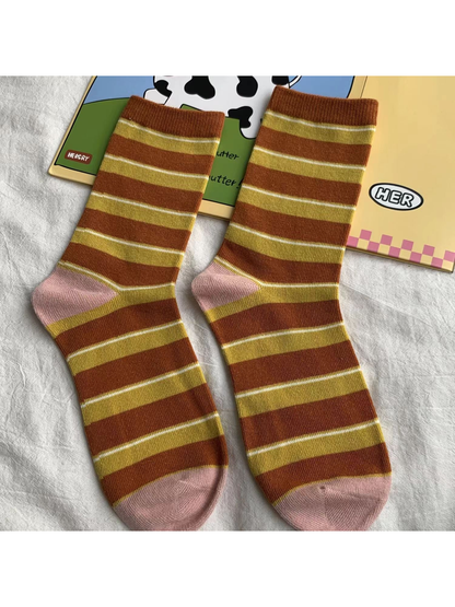 Brown striped crew socks with mustard and light pink accents