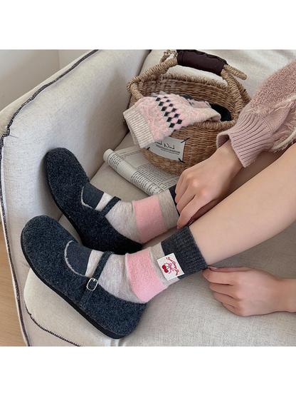 Fabric Label crew socks worn with charcoal Mary Jane slippers