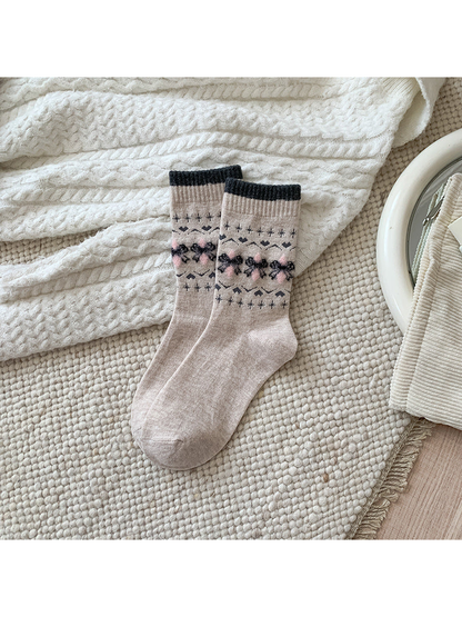 Bow crew socks with charcoal cuffs and pink accents