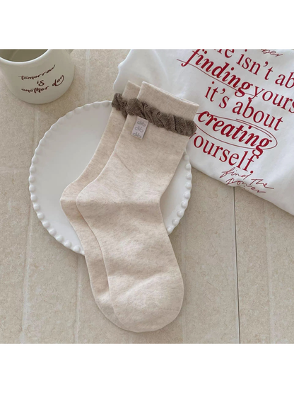 Beige Label socks with a brown gathered ruffle and exterior label