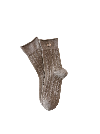 Cable style greige crew socks with rolled edges