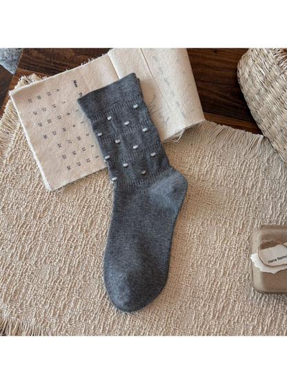 Dark Gray crew sock with miniature white flower motifs, flat display