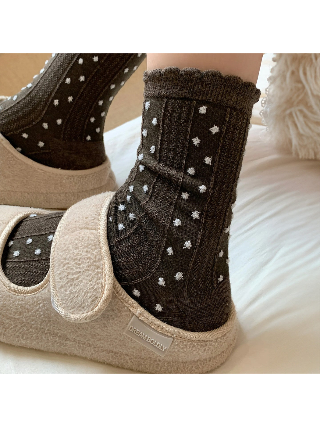 Coffee pointelle crew socks with white raised dots and a scalloped cuff