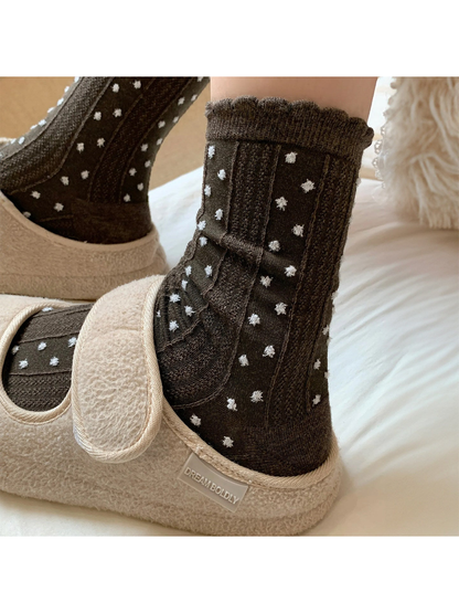 Coffee pointelle crew socks with white raised dots and a scalloped cuff