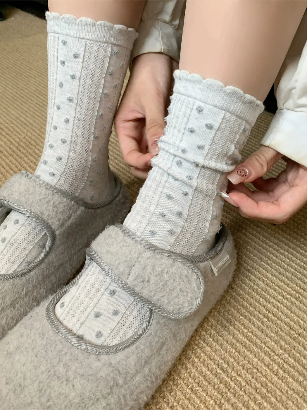 Gray Blue raised-dot crew socks styled with gray slippers
