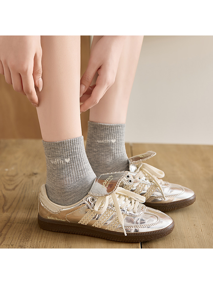 Heather Gray crew socks worn with metallic-look sneakers