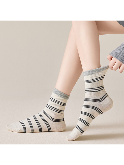 Gray striped crew socks worn in side view